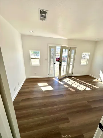 a view of livingroom with hardwood floor and hallway