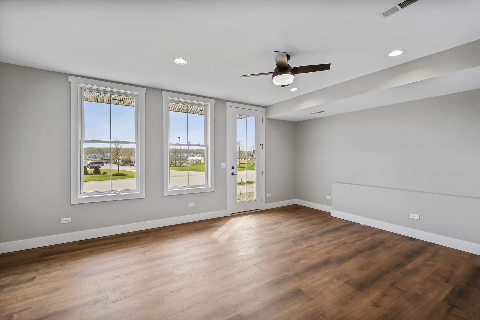 100 Great Loop E Drive, Unit 38 Ottawa, IL 61350 - Photo 5 of 15 an empty room with wooden floor and windows