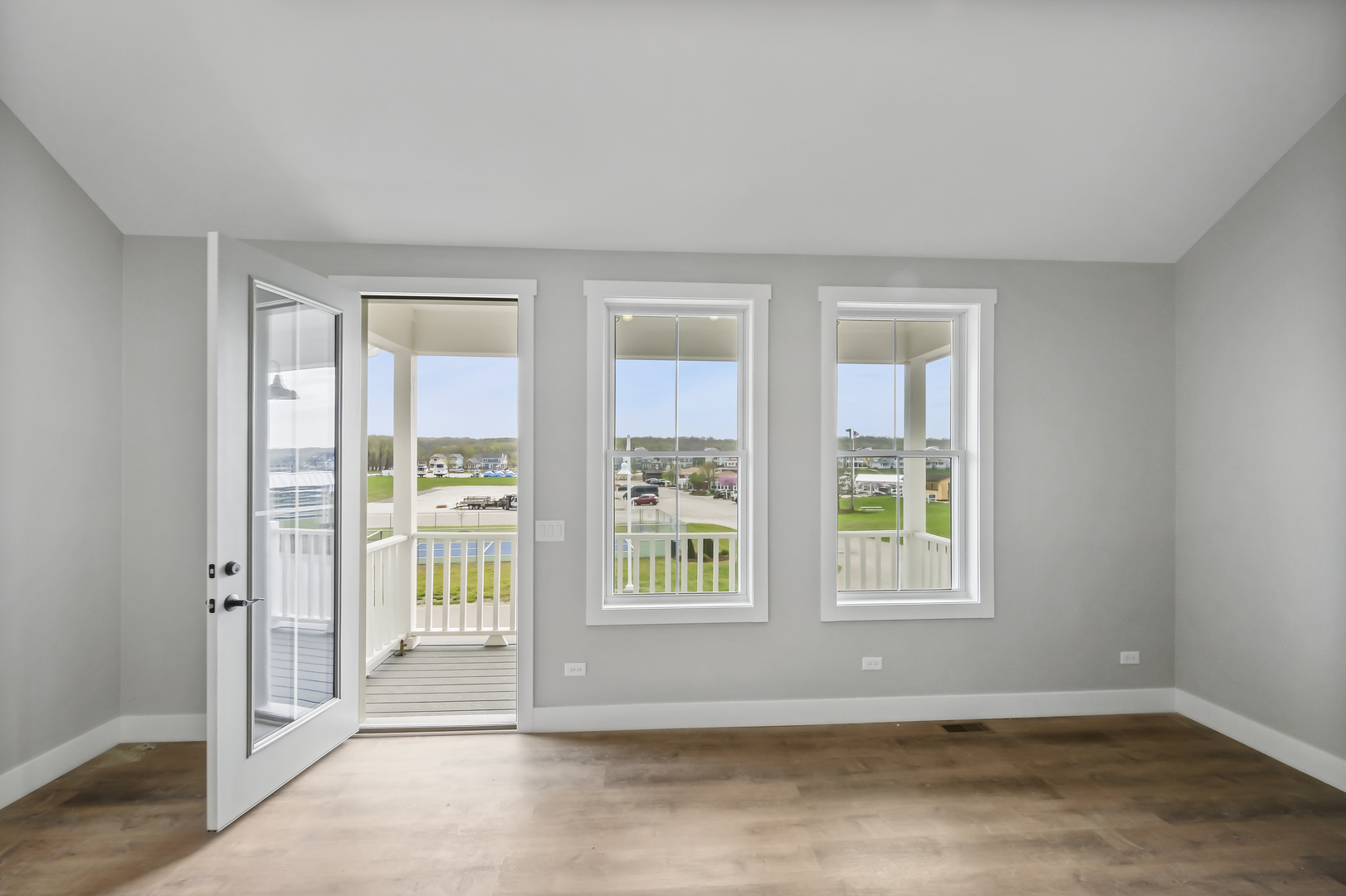 100 Great Loop E Drive, Unit 38 Ottawa, IL 61350 - Photo 9 of 15 a view of an empty room with wooden floor and a window