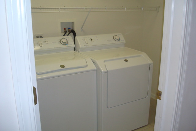 640 McHenry Road, Unit 2208 Wheeling, IL 60090 - Photo 13 of 17 a utility room with dryer and washer