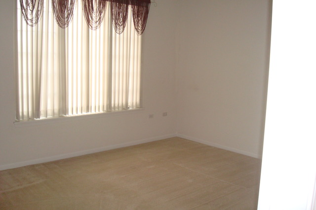 640 McHenry Road, Unit 2208 Wheeling, IL 60090 - Photo 10 of 17 an empty room with a window