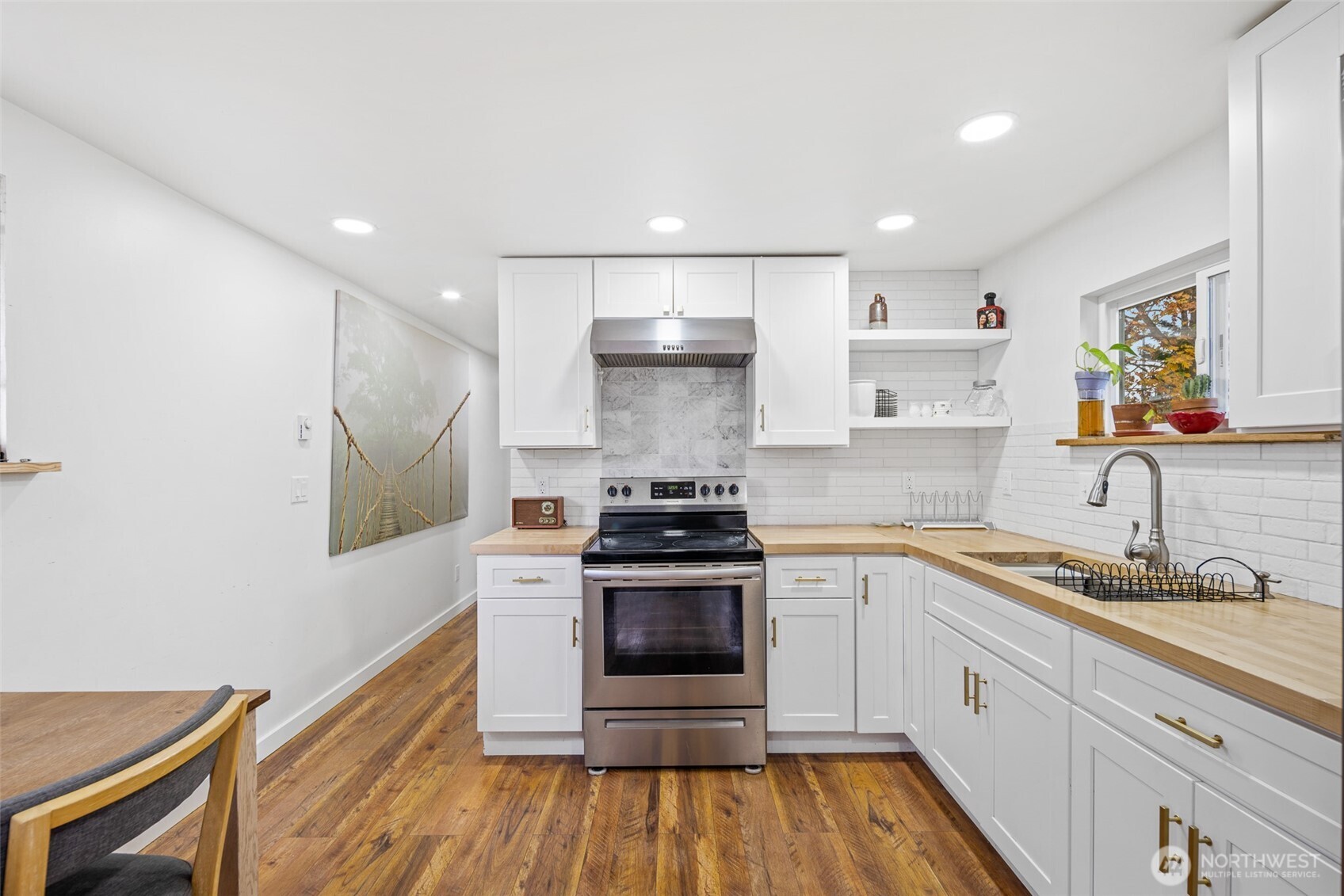 1645 South 272nd Street, Unit 13 Federal Way, WA 98003 - Photo 15 of 27 a kitchen with a stove oven and sink