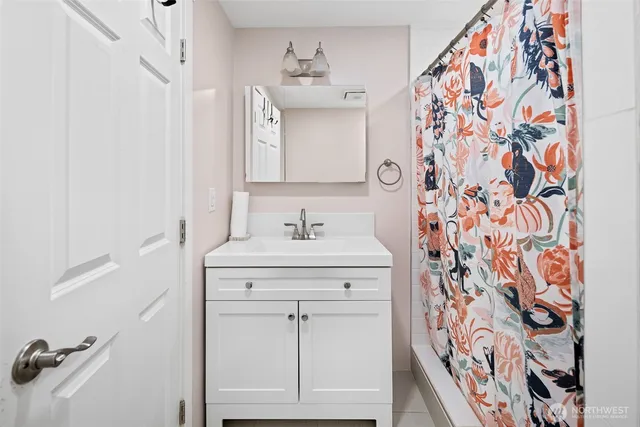 a bathroom with a sink and a mirror