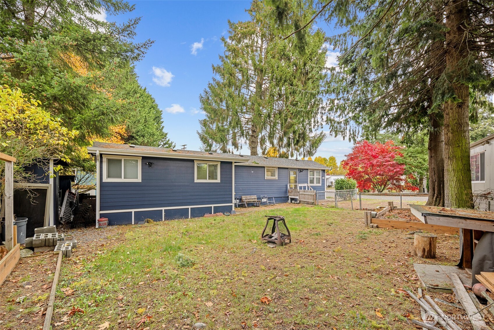 1645 South 272nd Street, Unit 13 Federal Way, WA 98003 - Photo 3 of 27 a view of a house with a yard