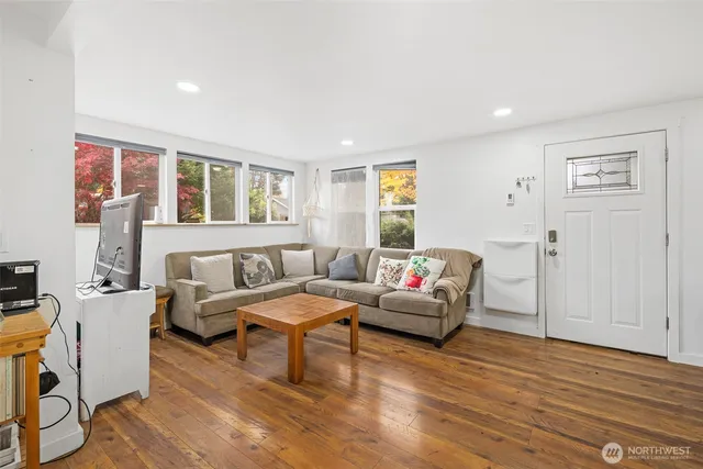 a living room with furniture and a window