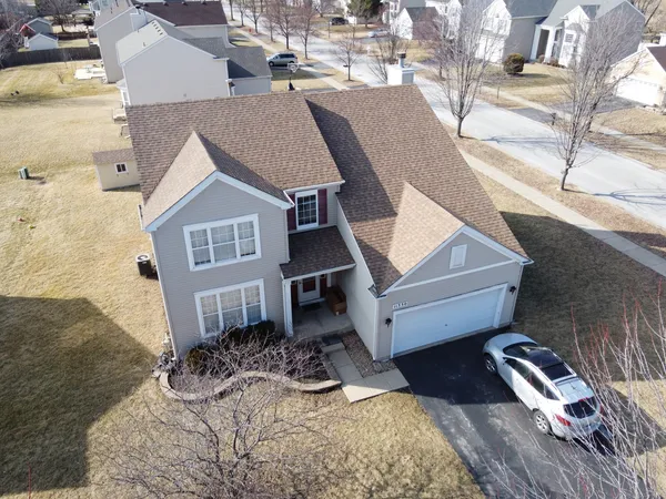 a aerial view of a house with a yard
