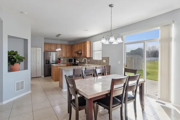 a dining room filled with furniture and window