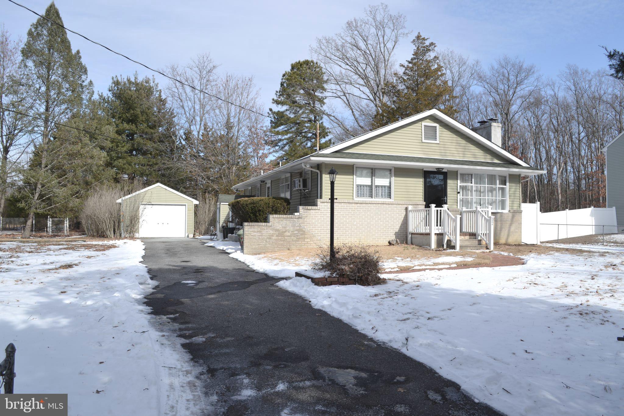 22 Rhode Island Road Sicklerville, NJ 08081 - Photo 2 of 2 a front view of a house with a yard