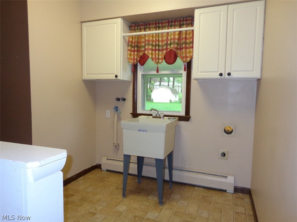 11167 Robson Road Grafton, OH 44044 - Photo 20 of 33 The first floor laundry room is conveniently located between the garage and kitchen