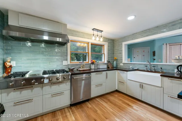 a kitchen with stainless steel appliances and cabinets