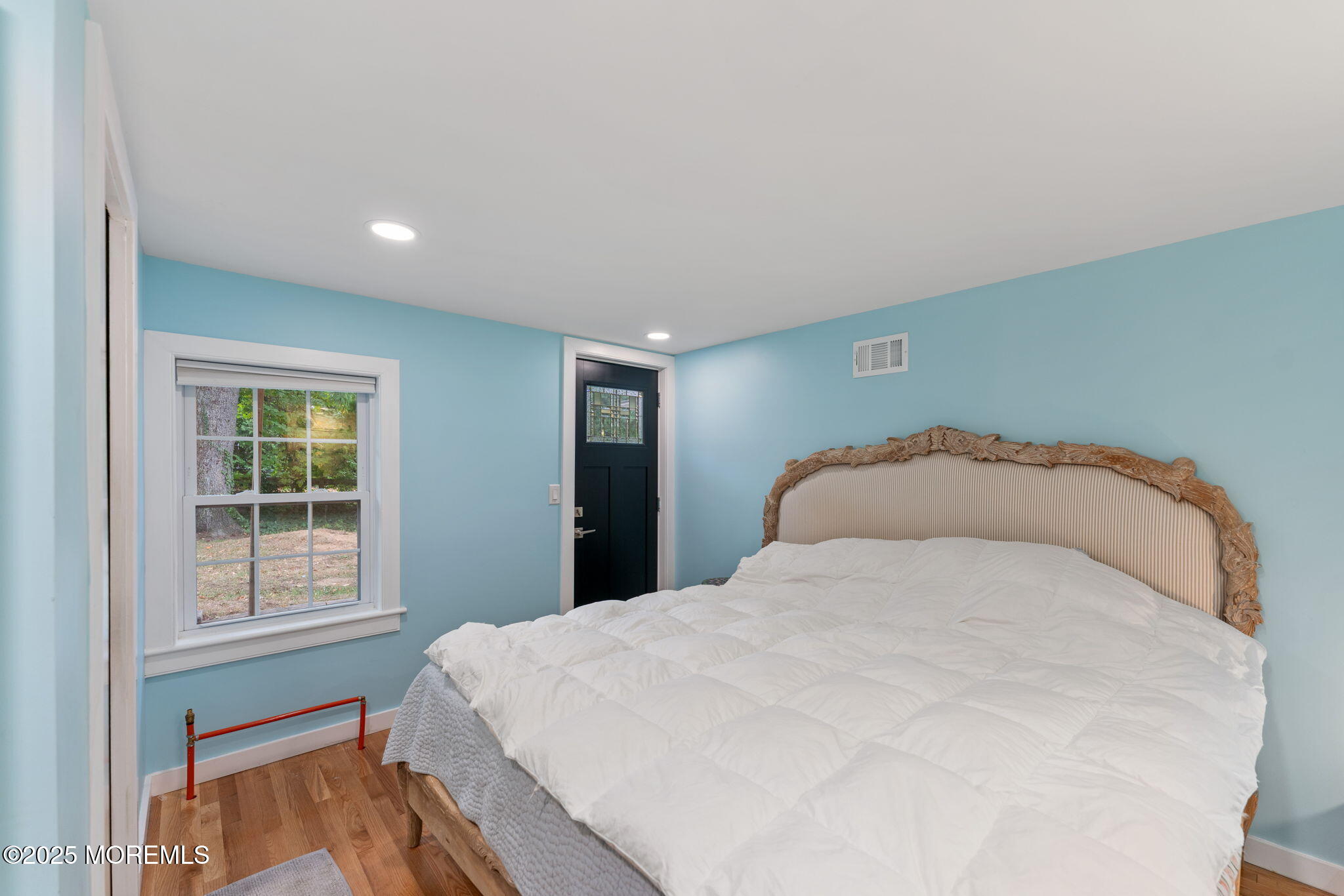 139 Monmouth Avenue Atlantic Highlands, NJ 07716 - Photo 22 of 40 a large bed sitting in a bedroom next to a window