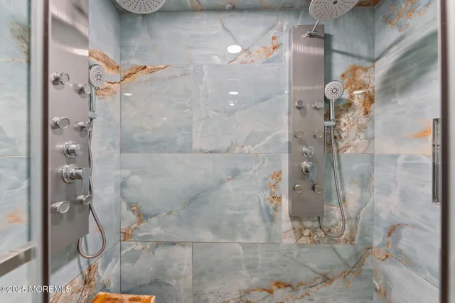 a bathroom with a bathtub and a sink