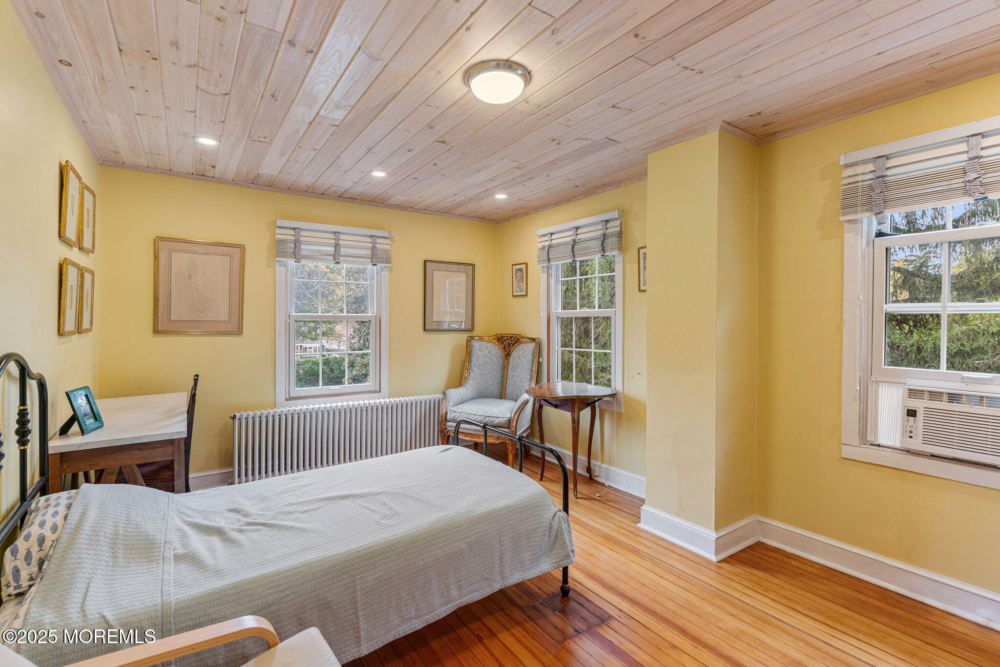 139 Monmouth Avenue Atlantic Highlands, NJ 07716 - Photo 31 of 40 a bedroom with a bed and wooden floor