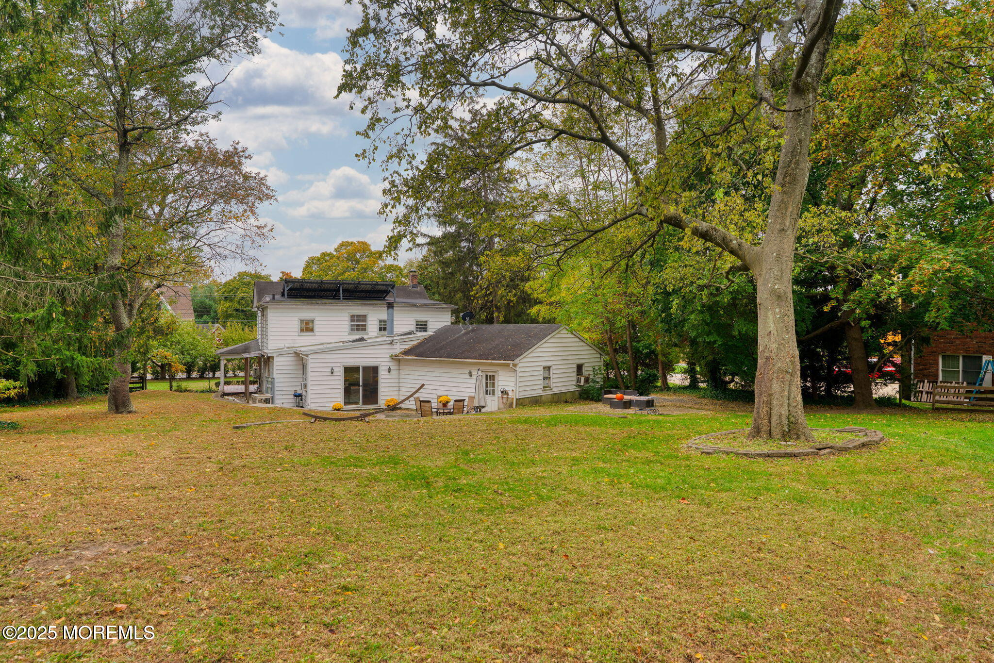 139 Monmouth Avenue Atlantic Highlands, NJ 07716 - Photo 35 of 40 a view of a house with a big yard and large trees