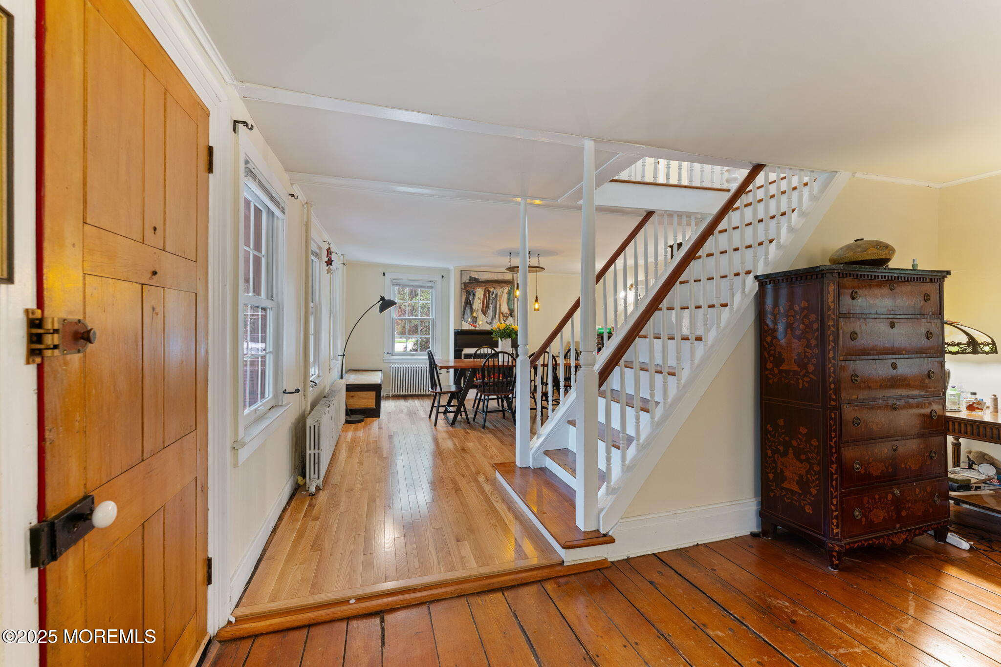 139 Monmouth Avenue Atlantic Highlands, NJ 07716 - Photo 10 of 40 a view of a livingroom with wooden floor and stairs