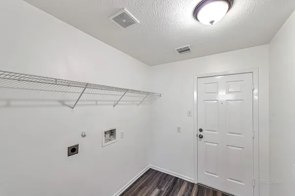 an empty room with a window and a ceiling fan