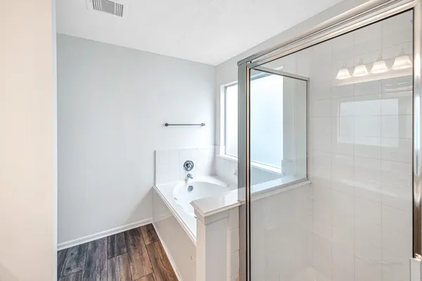 an empty room with an entryway and cabinet