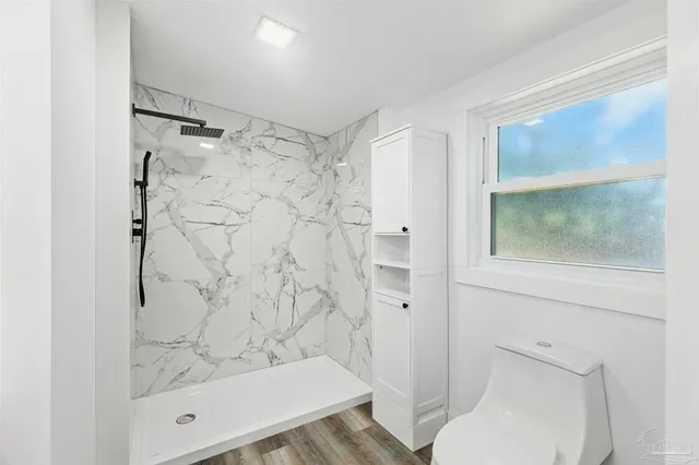 a bathroom with double sink and mirror