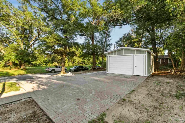 a house view with a backyard space