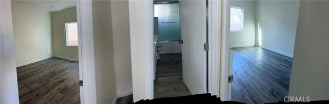 a view of a bathroom from a hallway