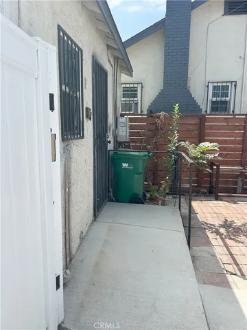 a balcony view with furniture and wooden floor