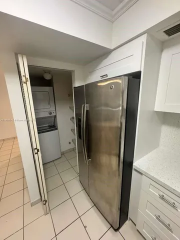 a bathroom with a glass door shower and a sink