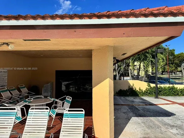 a view of balcony with furniture