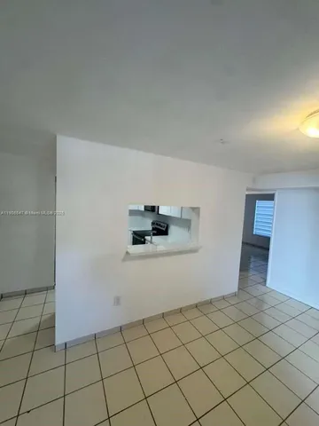 a view of a refrigerator and window