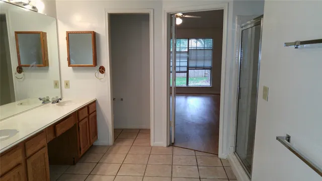 a bathroom with a sink and mirror
