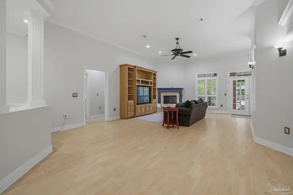 a living room with furniture and a chandelier