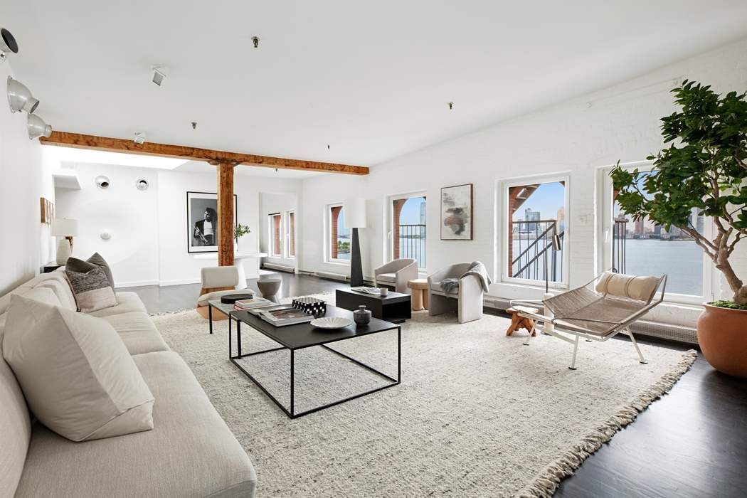 288 West Street, Unit PH Manhattan, NY 10013 - Photo 1 of 19 a living room with furniture and a large window