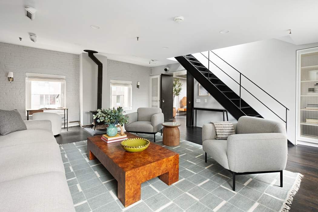 288 West Street, Unit PH Manhattan, NY 10013 - Photo 14 of 19 a living room with furniture and a wooden floor