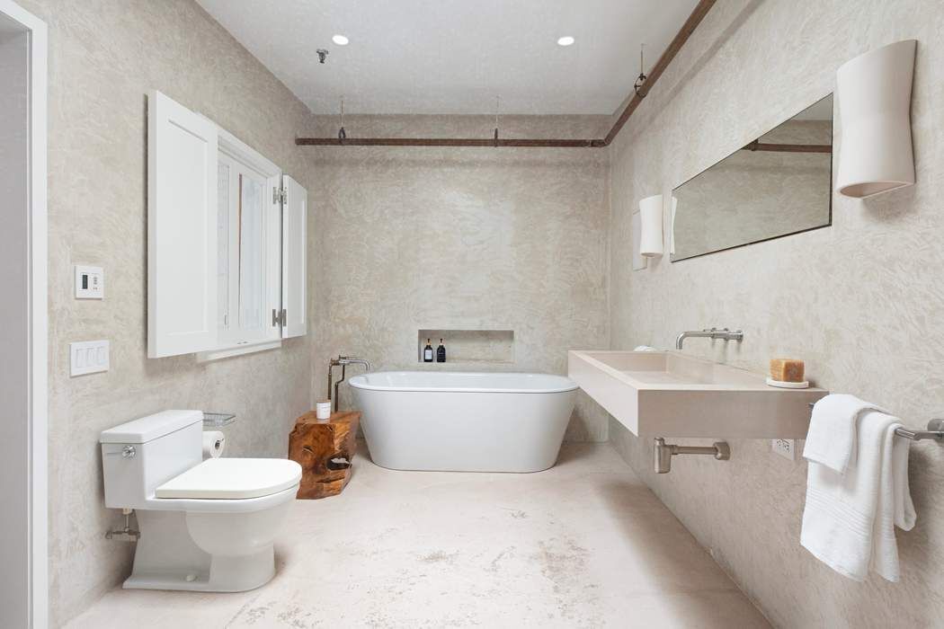 288 West Street, Unit PH Manhattan, NY 10013 - Photo 6 of 19 a bathroom with a sink a toilet and bathtub