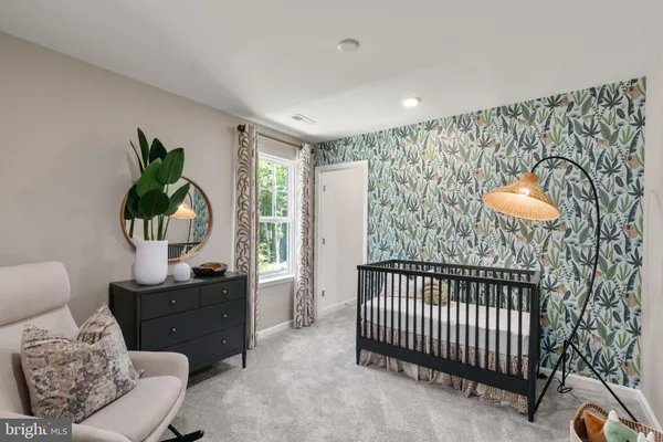 a bedroom with furniture and a window