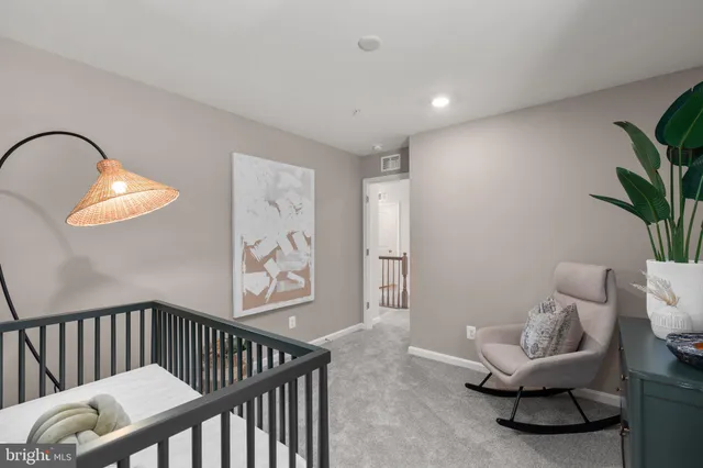 a living room with furniture and a mirror