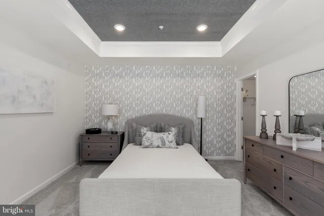 a bedroom with a bed and a bathroom