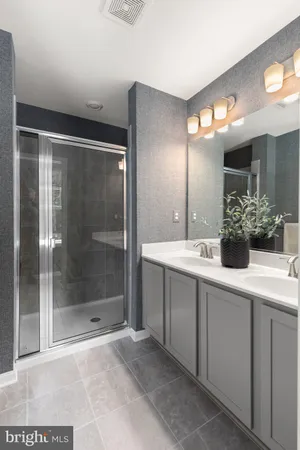 a bathroom with a sink and mirror