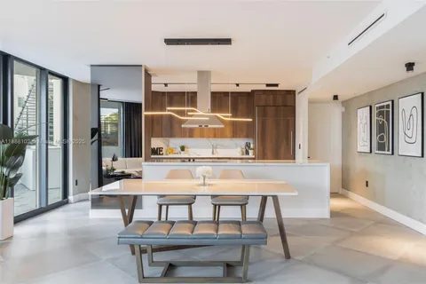 a dining room with a table and chairs