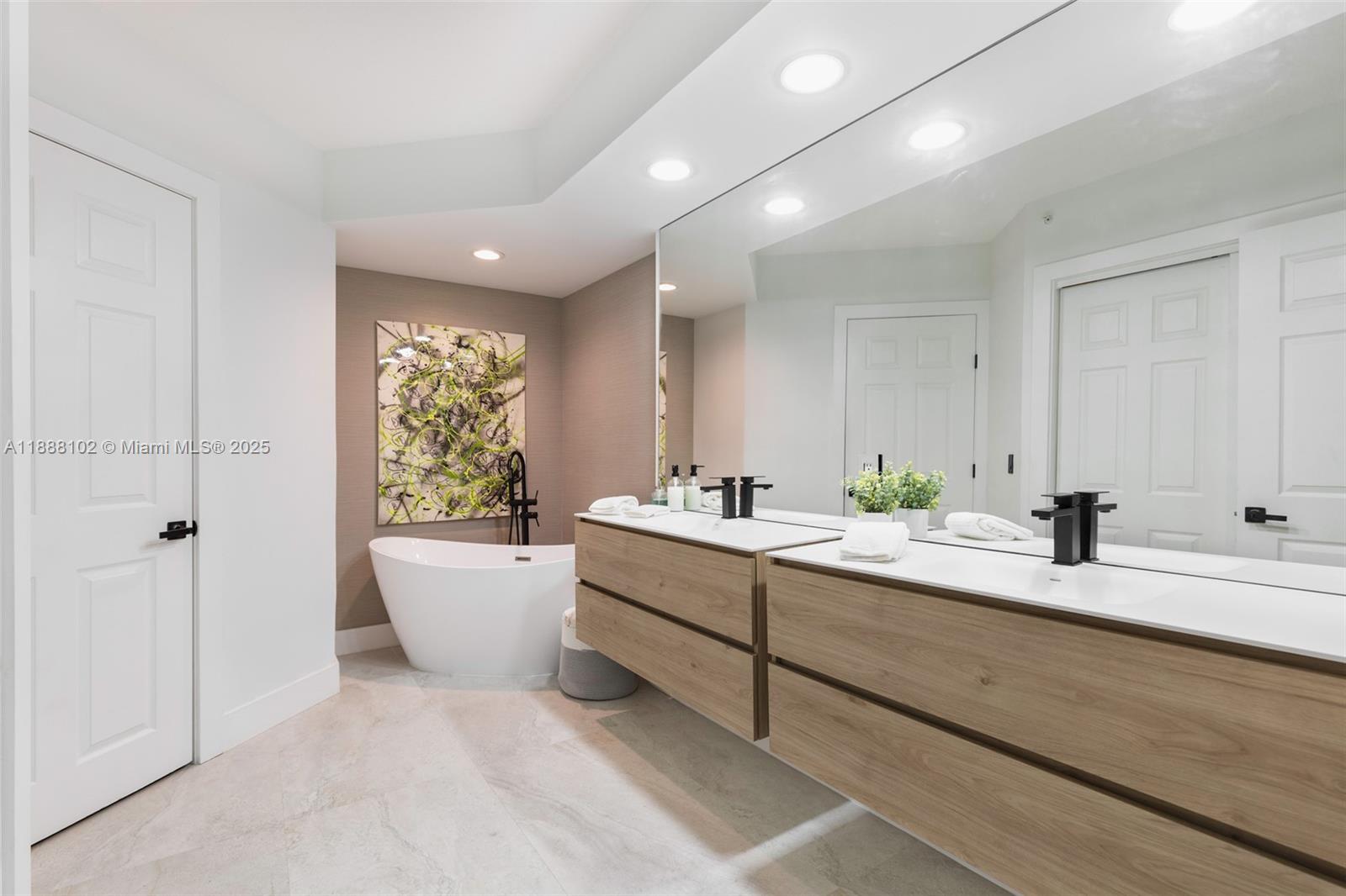 3370 Hidden Bay Drive, Unit 409 Aventura, FL 33180 - Photo 13 of 20 a large white room with a large window and white doors