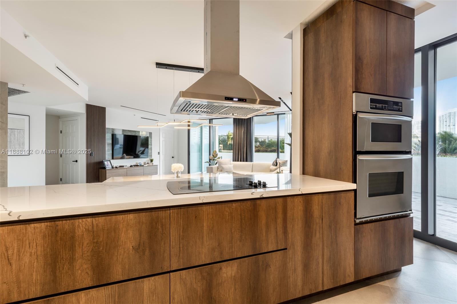 3370 Hidden Bay Drive, Unit 409 Aventura, FL 33180 - Photo 4 of 20 a kitchen with stainless steel appliances granite countertop a sink a stove and a refrigerator