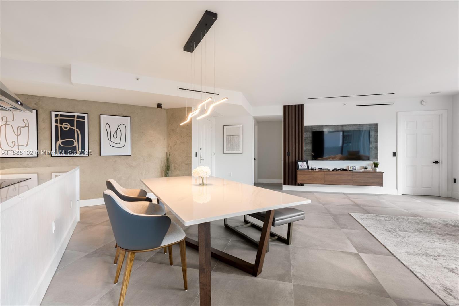 3370 Hidden Bay Drive, Unit 409 Aventura, FL 33180 - Photo 6 of 20 a living room with furniture and a flat screen tv