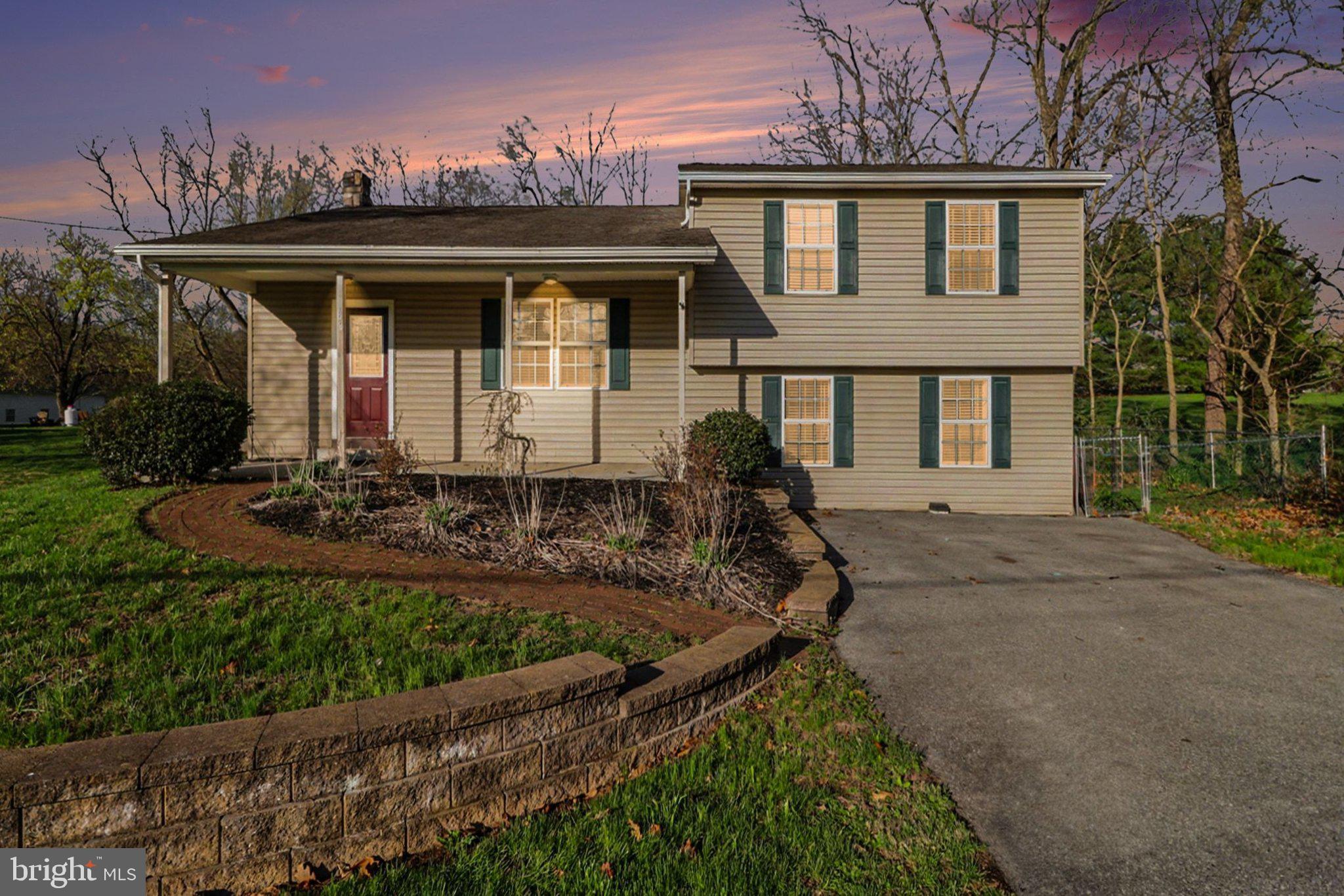 front view of a house with a yard