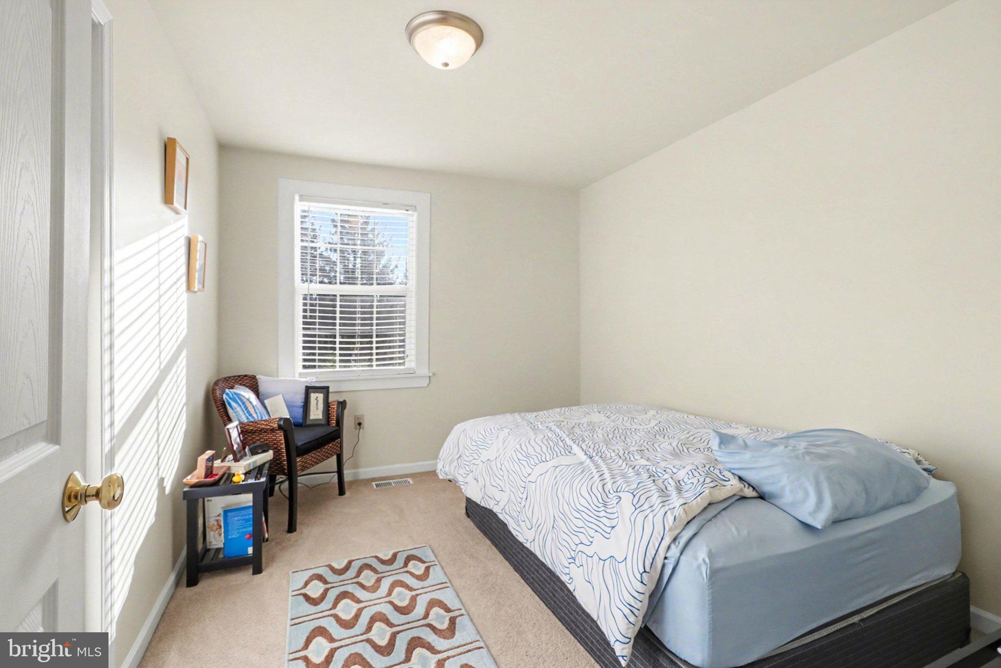 88 McAllister Church Road Carlisle, PA 17015 - Photo 14 of 43 a bedroom with a bed and wooden floor