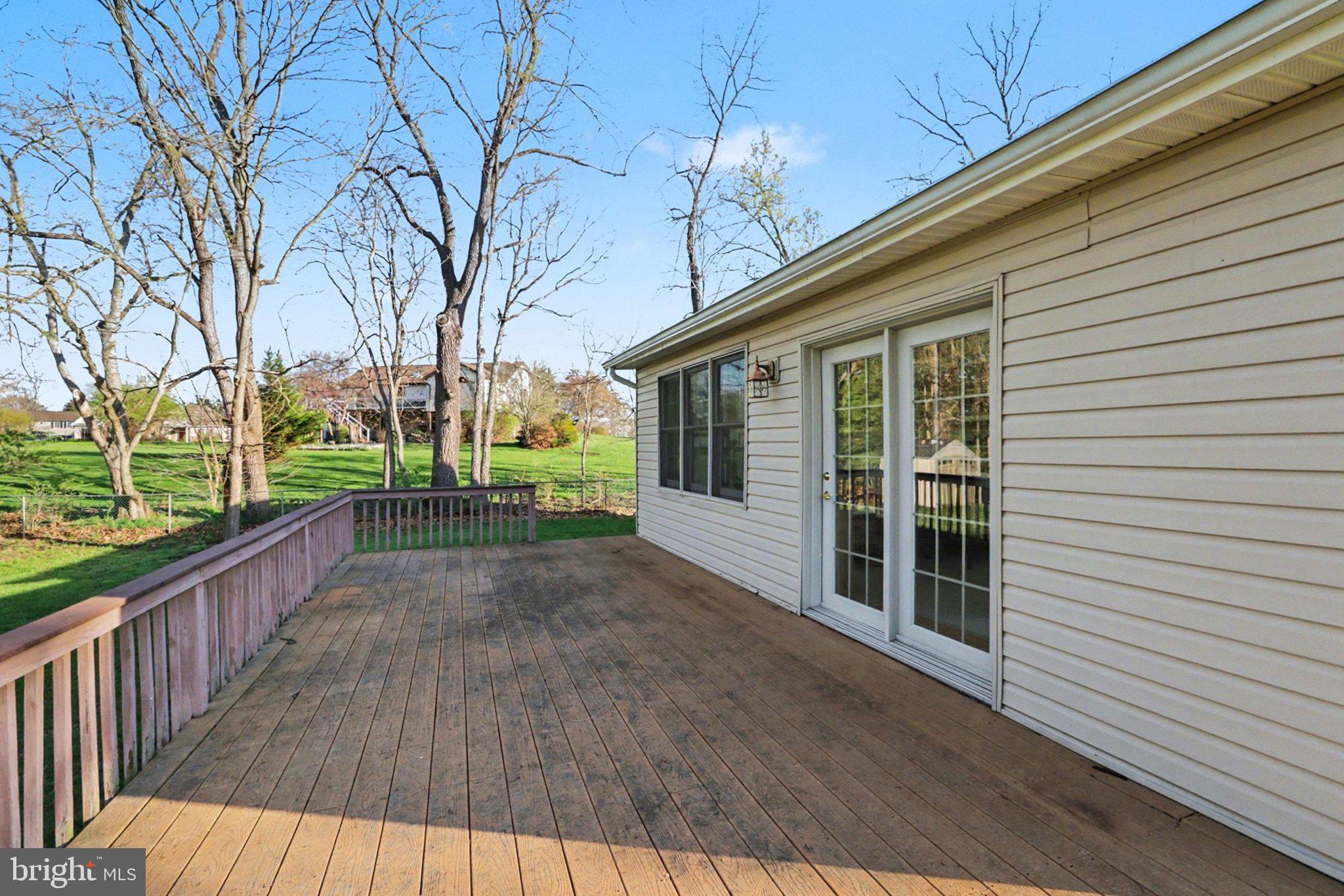 88 McAllister Church Road Carlisle, PA 17015 - Photo 32 of 43 a view of a porch with wooden floor and fence