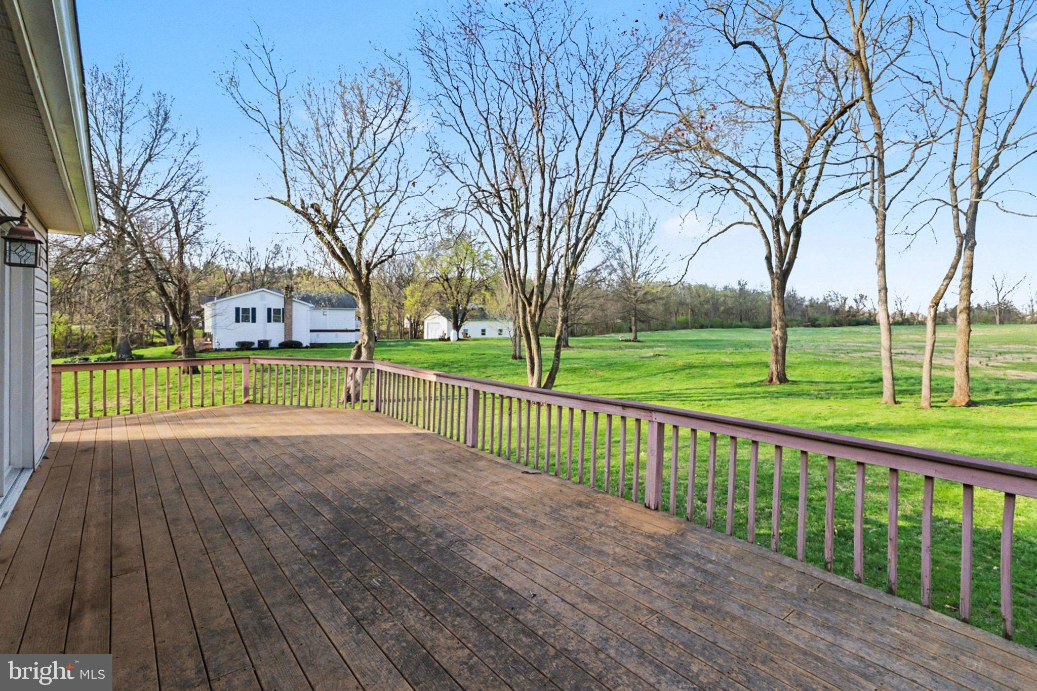 88 McAllister Church Road Carlisle, PA 17015 - Photo 34 of 43 a view of a park with large trees and wooden fence