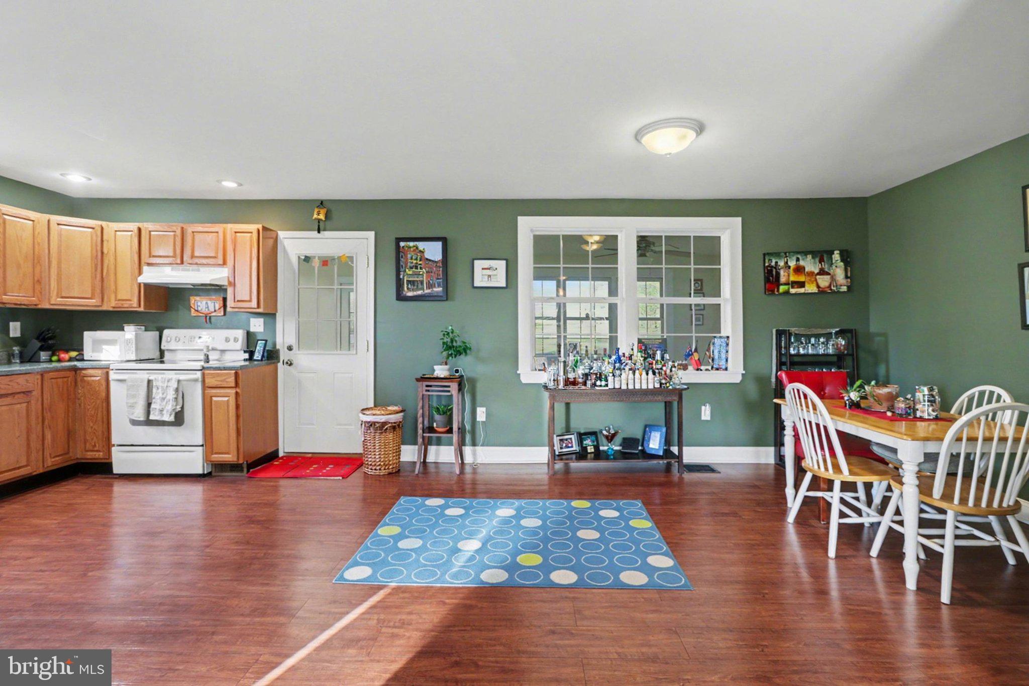 88 McAllister Church Road Carlisle, PA 17015 - Photo 6 of 43 a living room with dining room and wooden floor
