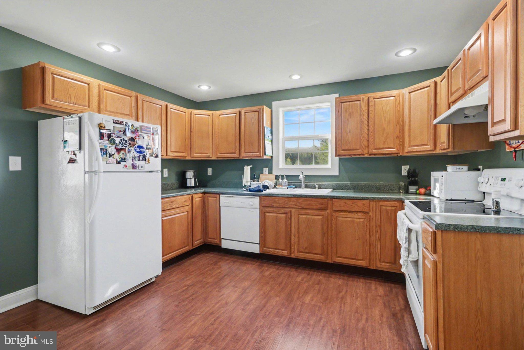 88 McAllister Church Road Carlisle, PA 17015 - Photo 10 of 43 a kitchen with granite countertop stainless steel appliances a refrigerator sink and microwave