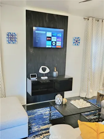 a living room with a couch and a flat screen tv