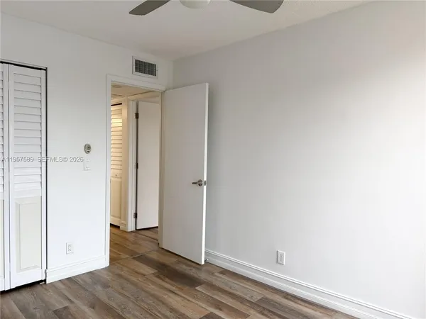 a bathroom with a toilet and a bathtub