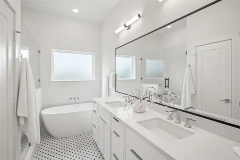 a bathroom with a bathtub and a shower